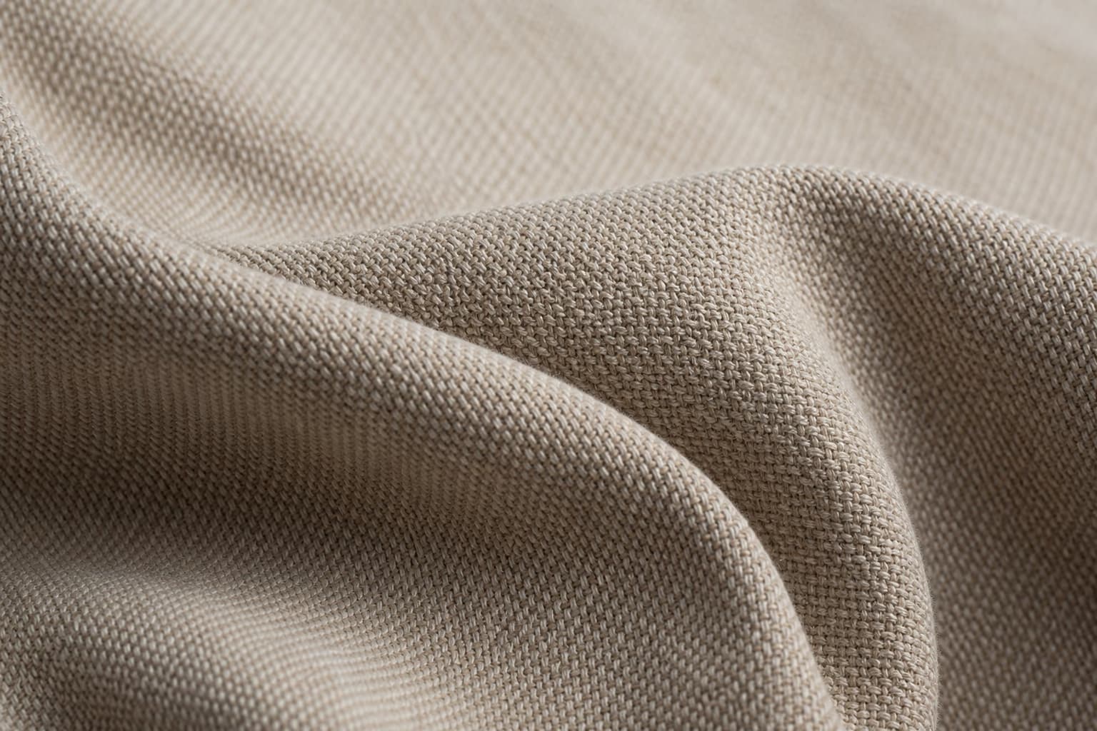 Macro of 380 g/m² cotton canvas in cool morning light with weave pattern visible.
